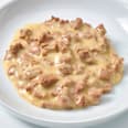 Cibo umido per gatti Exquisit, ricco di pollo in salsa di formaggio DEIN BESTES