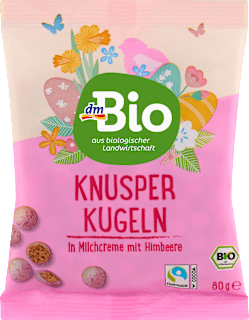 malinové křupavé kuličky v bílé čokoládě, kukuřičný extrudát dmBio